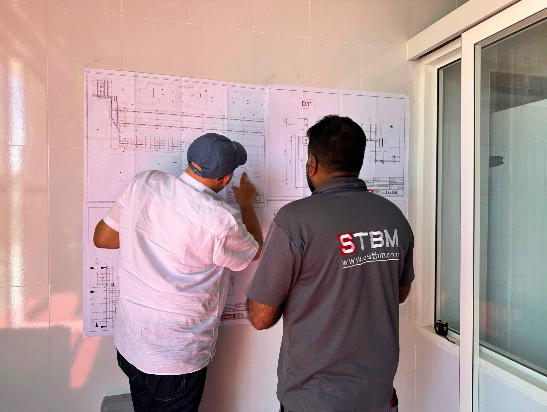 STBM team installing stainless steel processing equipment on site